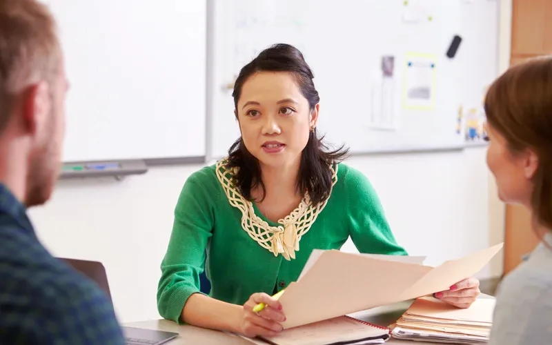 East Asian education adviser discussing options with students
