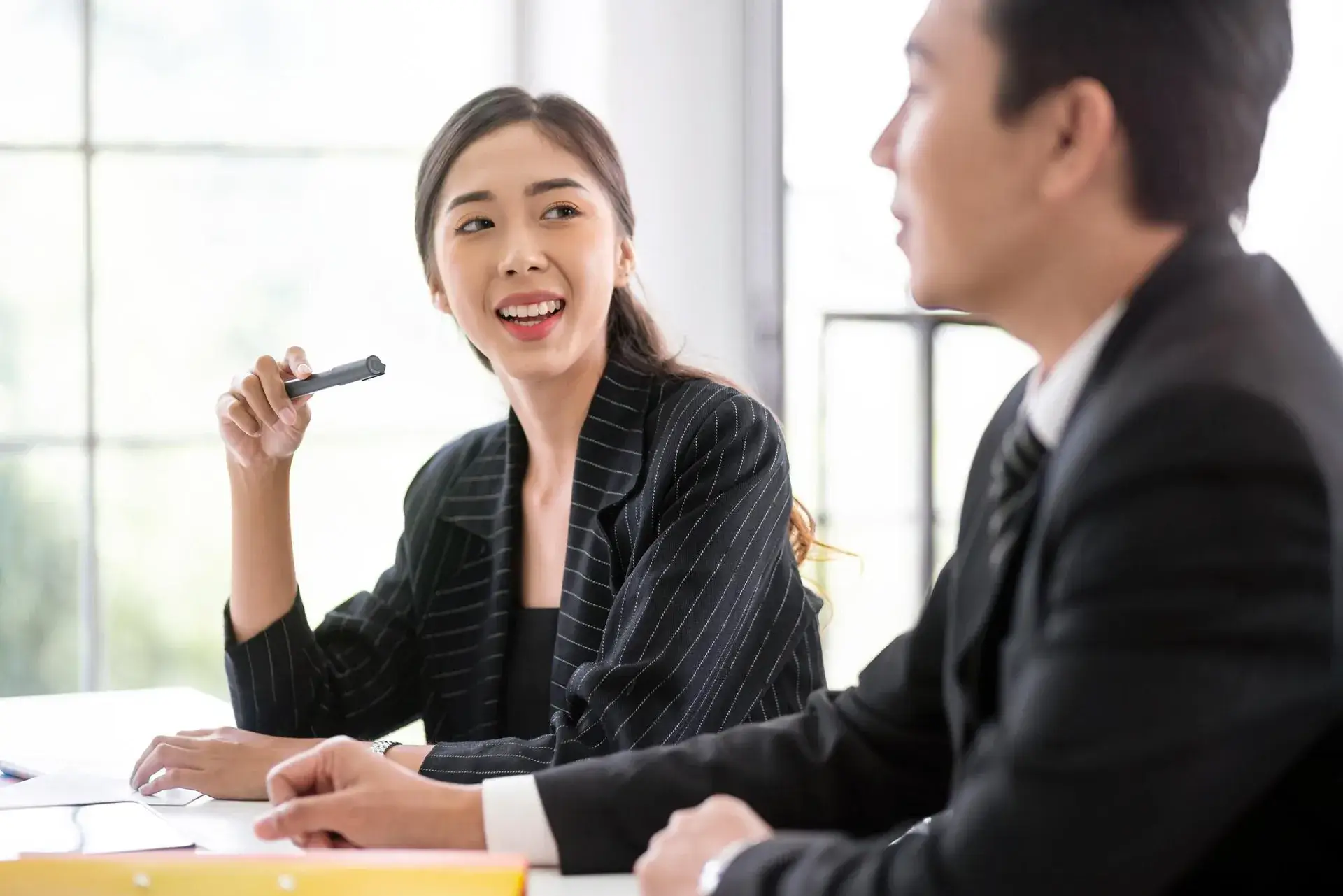 East Asian woman adviser in a professional consultation meeting
